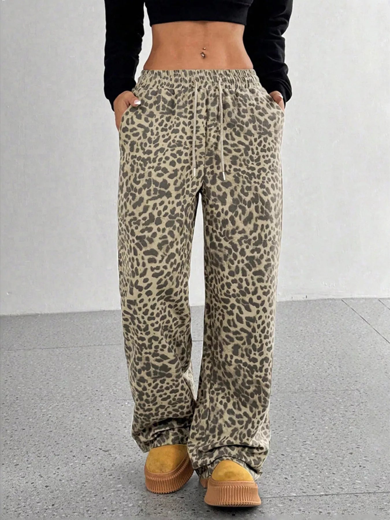 Plus size leopard print wide leg pants by Trendsi, featuring a full-length design and bold animal print fabric.