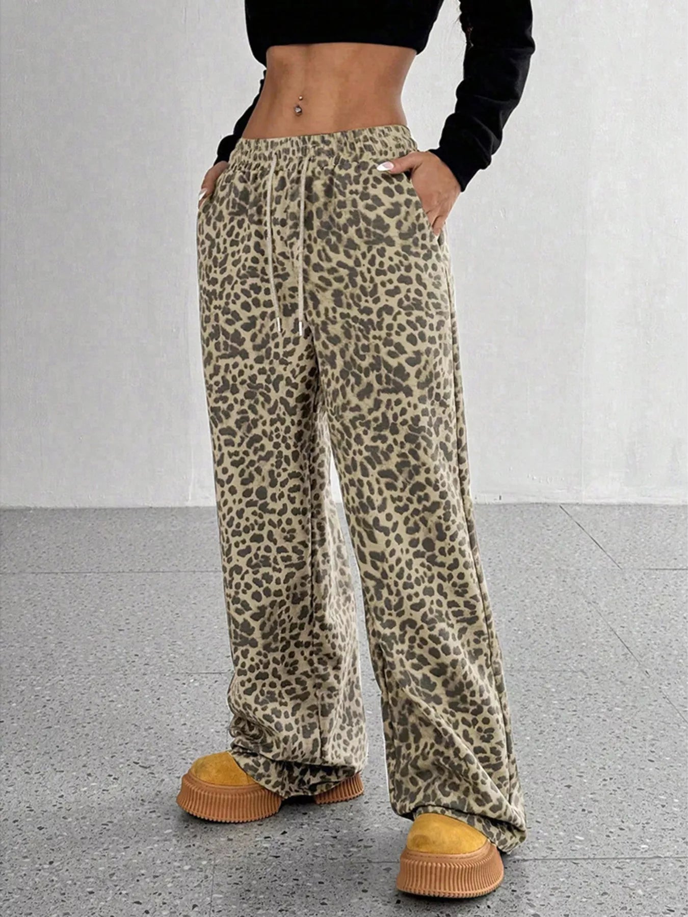 Plus size leopard print wide leg pants from Trendsi featuring a full-length design and bold animal print fabric.