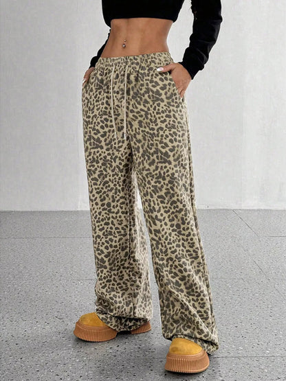 Plus size leopard print wide leg pants from Trendsi featuring a full-length design and bold animal print fabric.