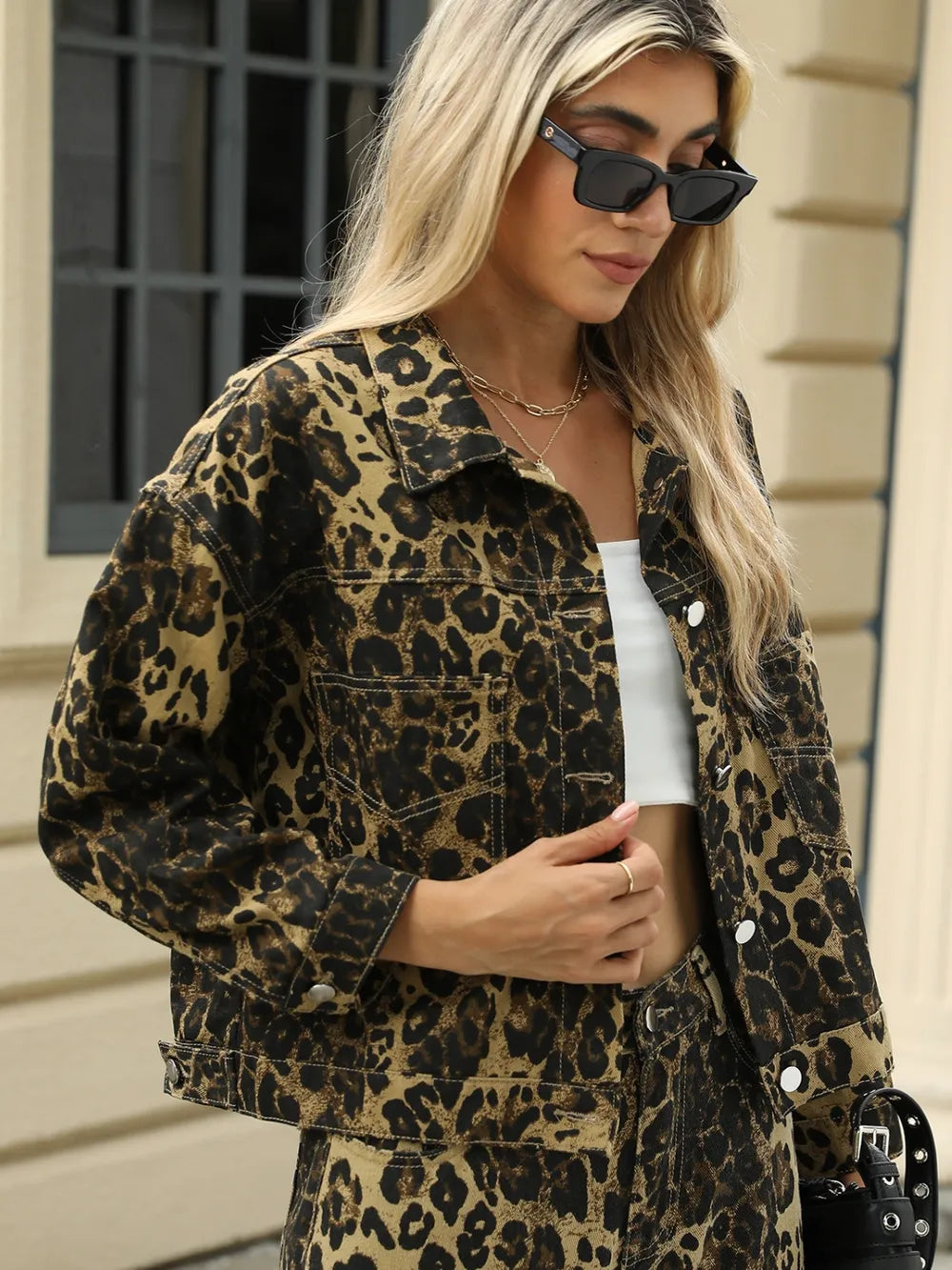 Leopard print long sleeve denim jacket with front pockets from Trendsi, stylish and casual for everyday wear.