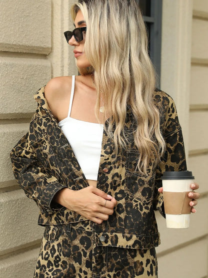 Leopard print long sleeve denim jacket with chest pockets by Trendsi, featuring a stylish, casual design and classic button closure.