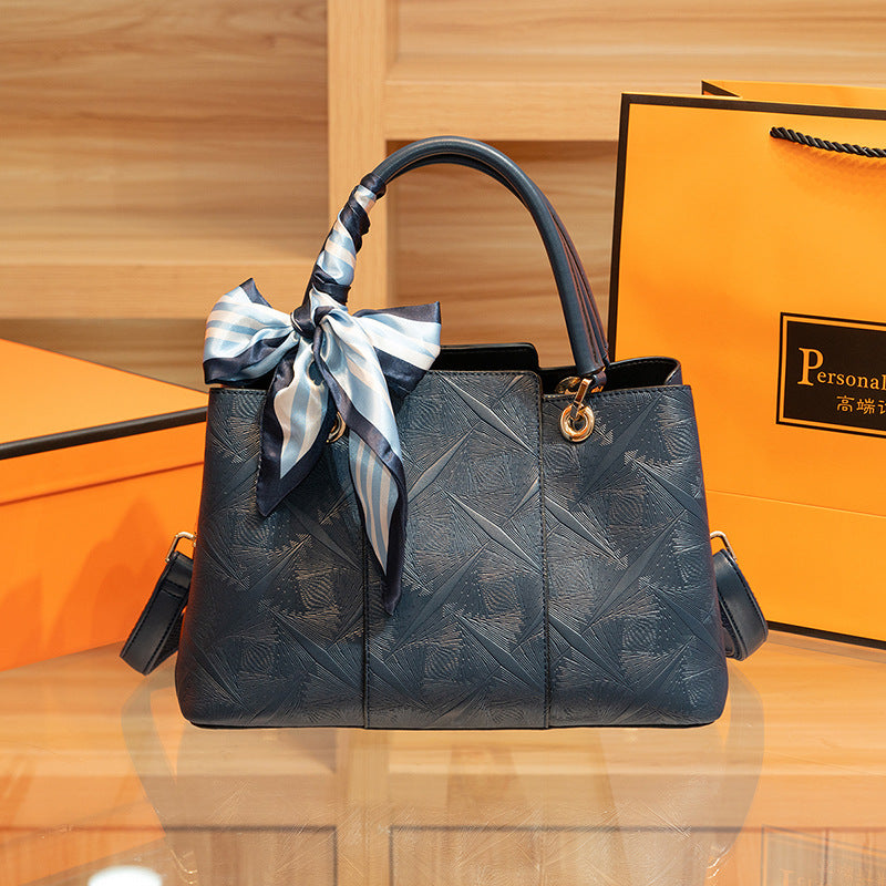 Light blue top-handle handbag by Trendsi with a sleek design and structured shape, ideal for elegant everyday use.