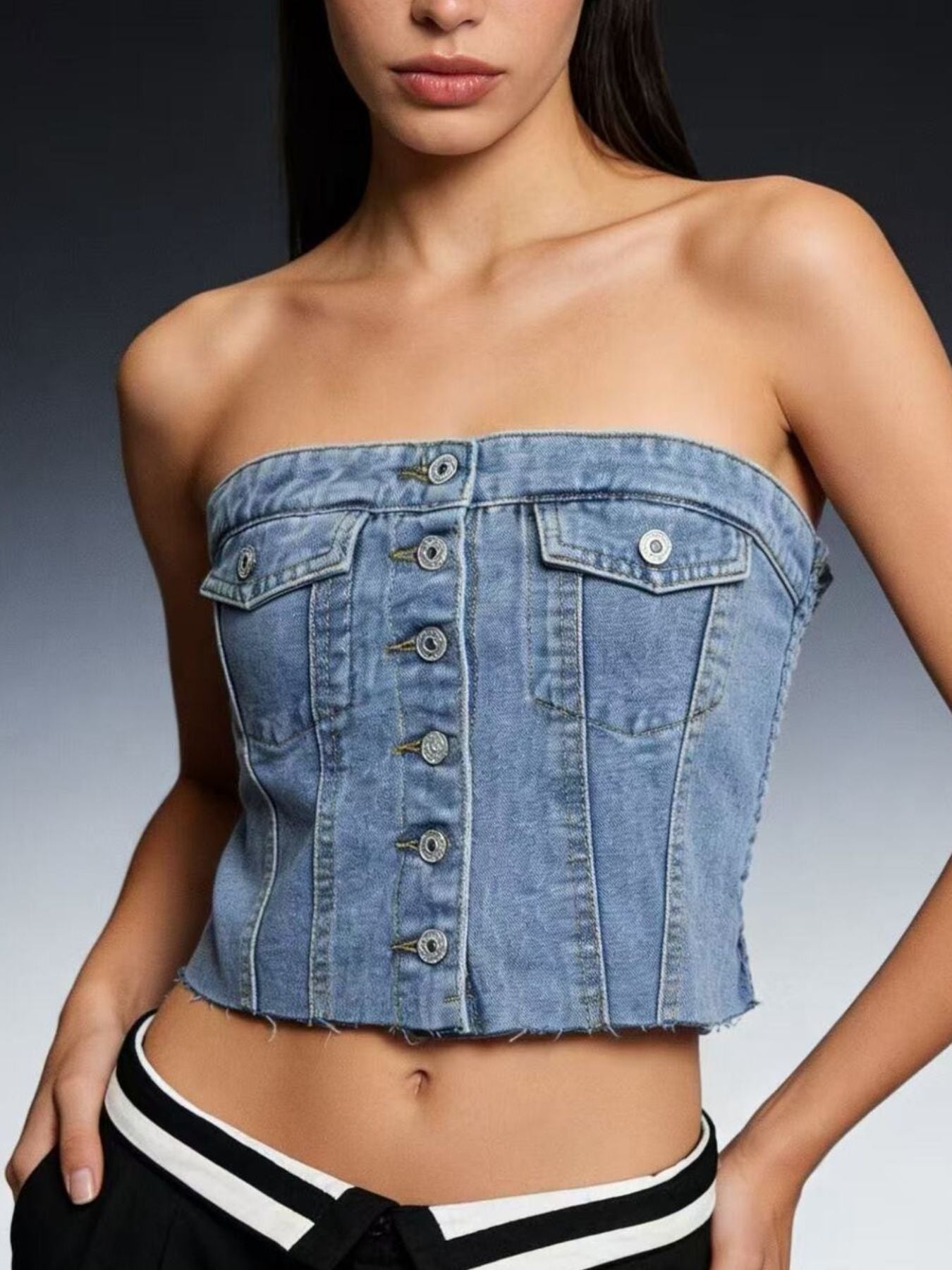 Light blue button-front strapless denim top by Trendsi, showing the fitted sleeveless design with front buttons and neckline.