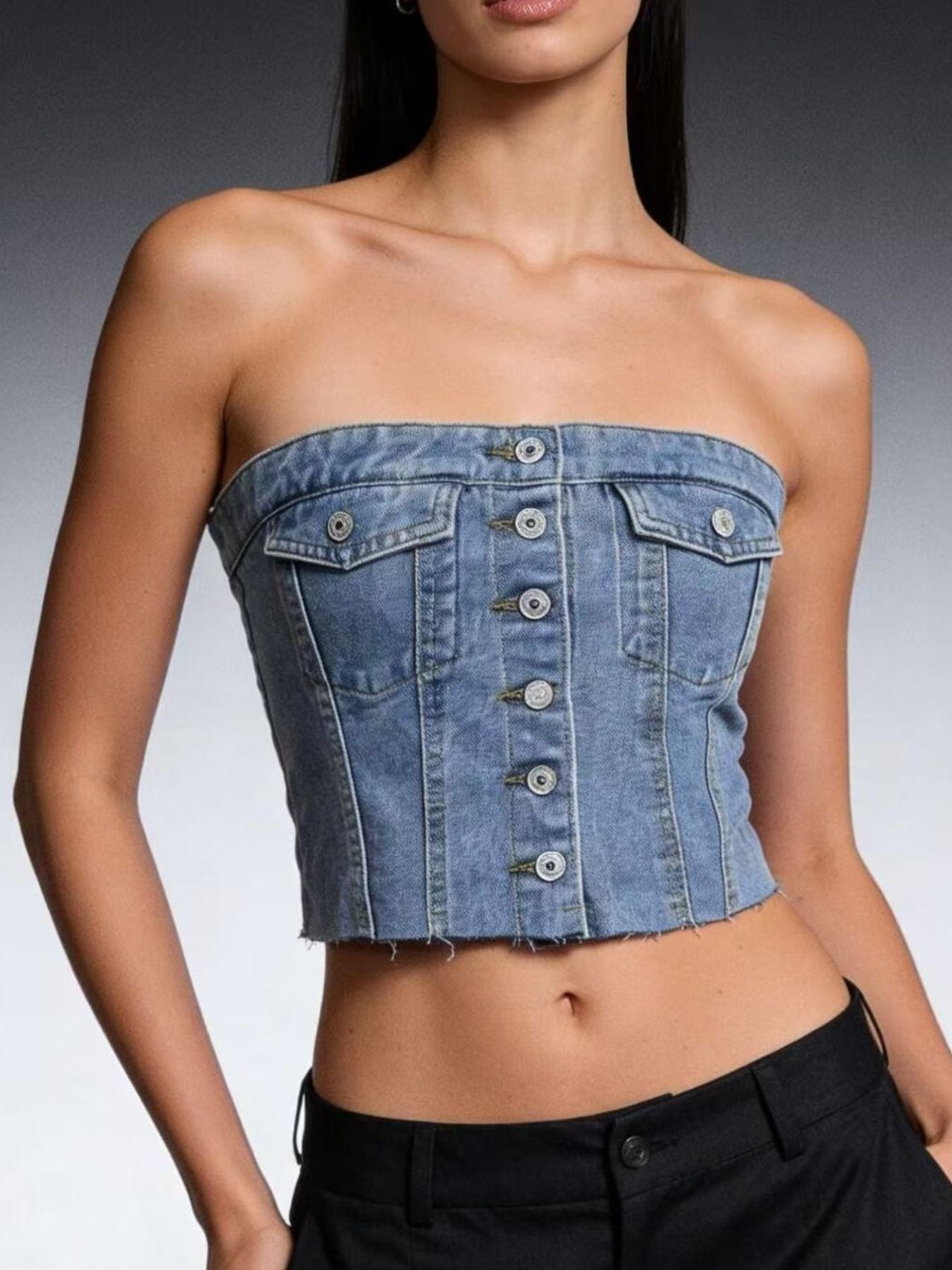 Light blue button-front strapless denim top from Trendsi featuring a fitted silhouette and classic denim texture.