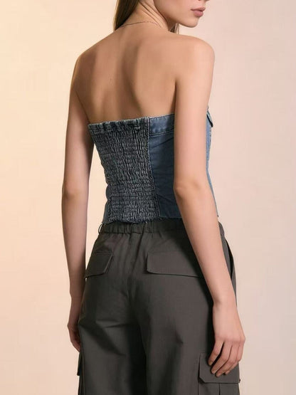 Light blue button-front strapless denim top from Trendsi, featuring a fitted design and sleeveless style.
