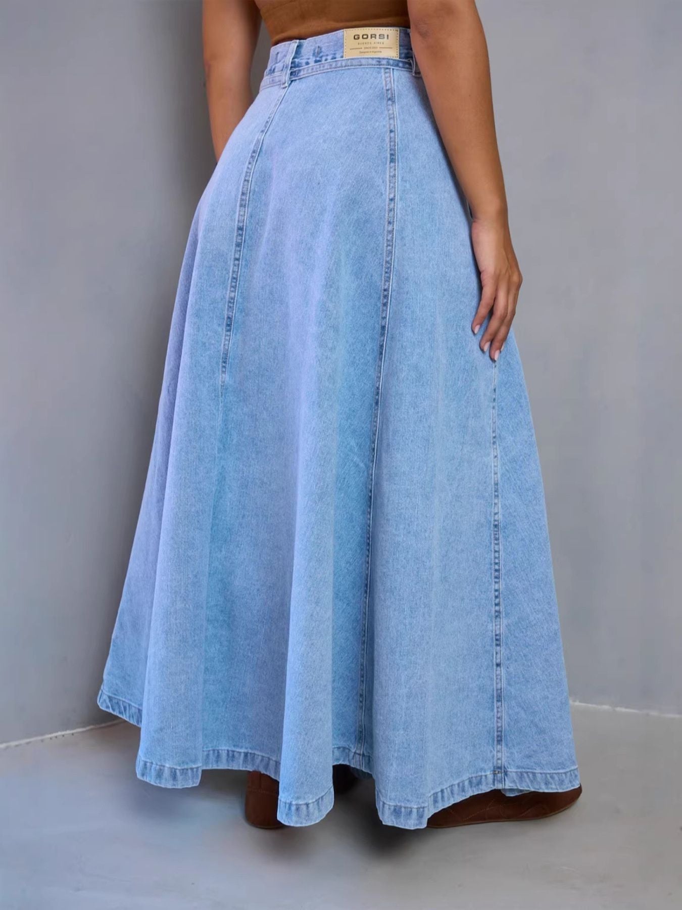 Light blue high-waisted denim skirt from Trendsi, featuring a classic A-line design and visible stitching.
