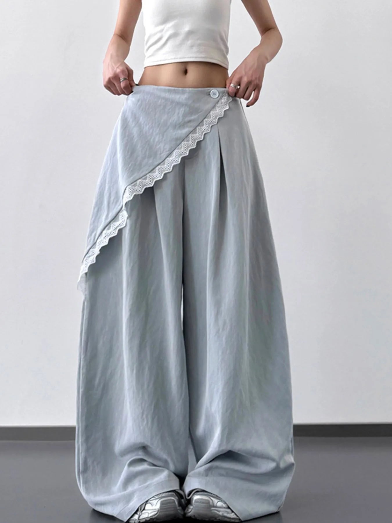 Light blue Trendsi lace detail wide-leg pants with a flowing silhouette and intricate lace accents, perfect for casual or dressy wear.