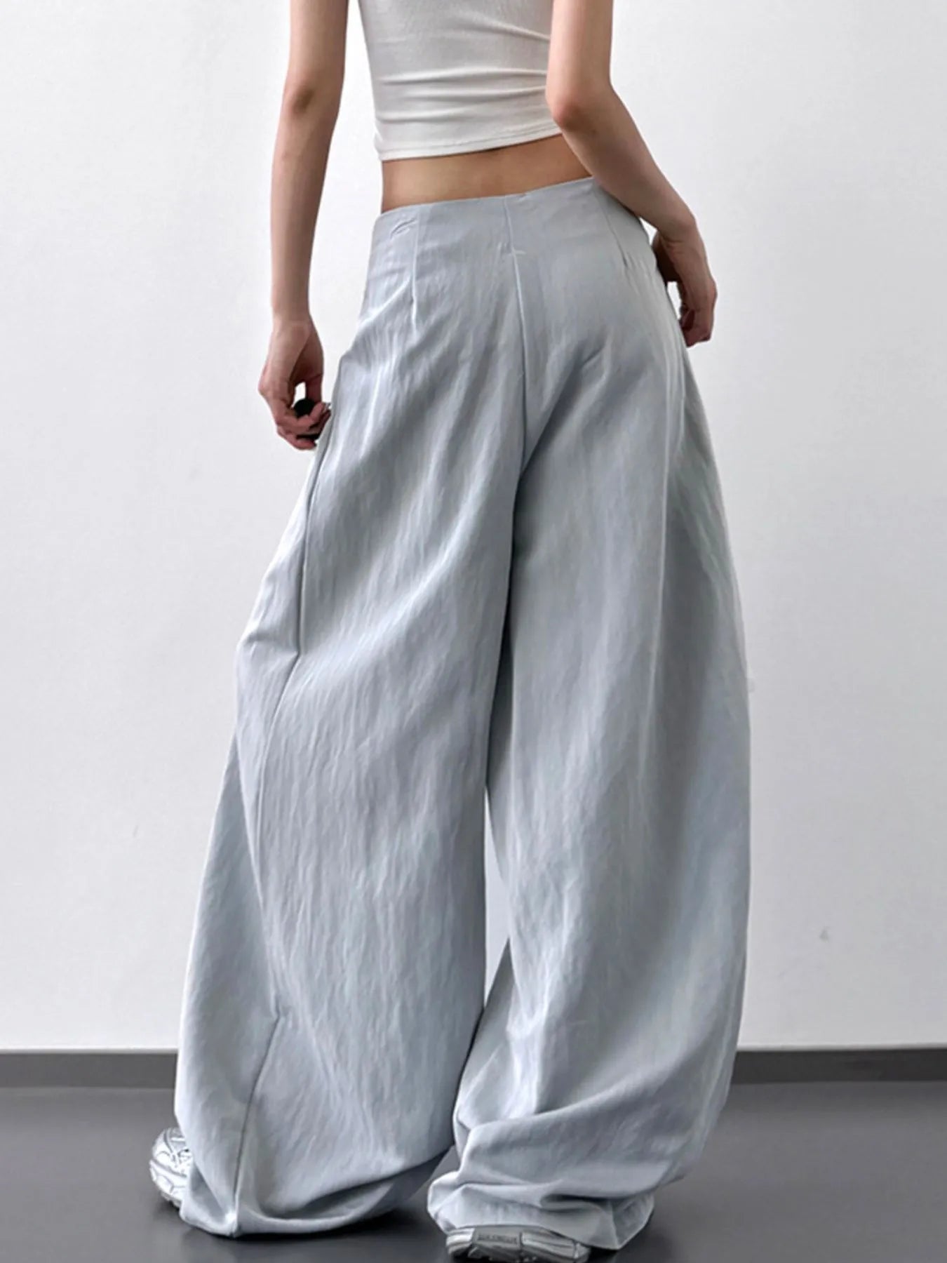 Light blue lace detail wide-leg pants by Trendsi, featuring flowing fabric and elegant design for a stylish look.