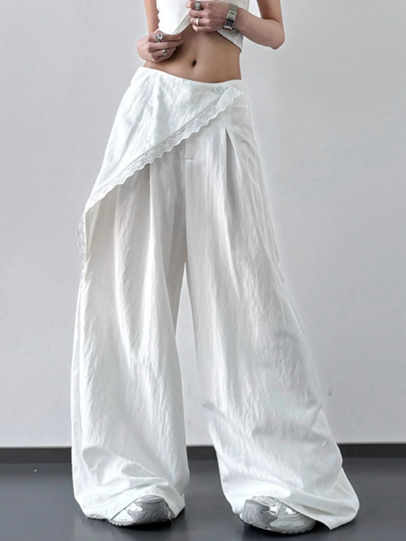 Light blue lace detail wide-leg pants from Trendsi featuring flowing fabric and elegant design.