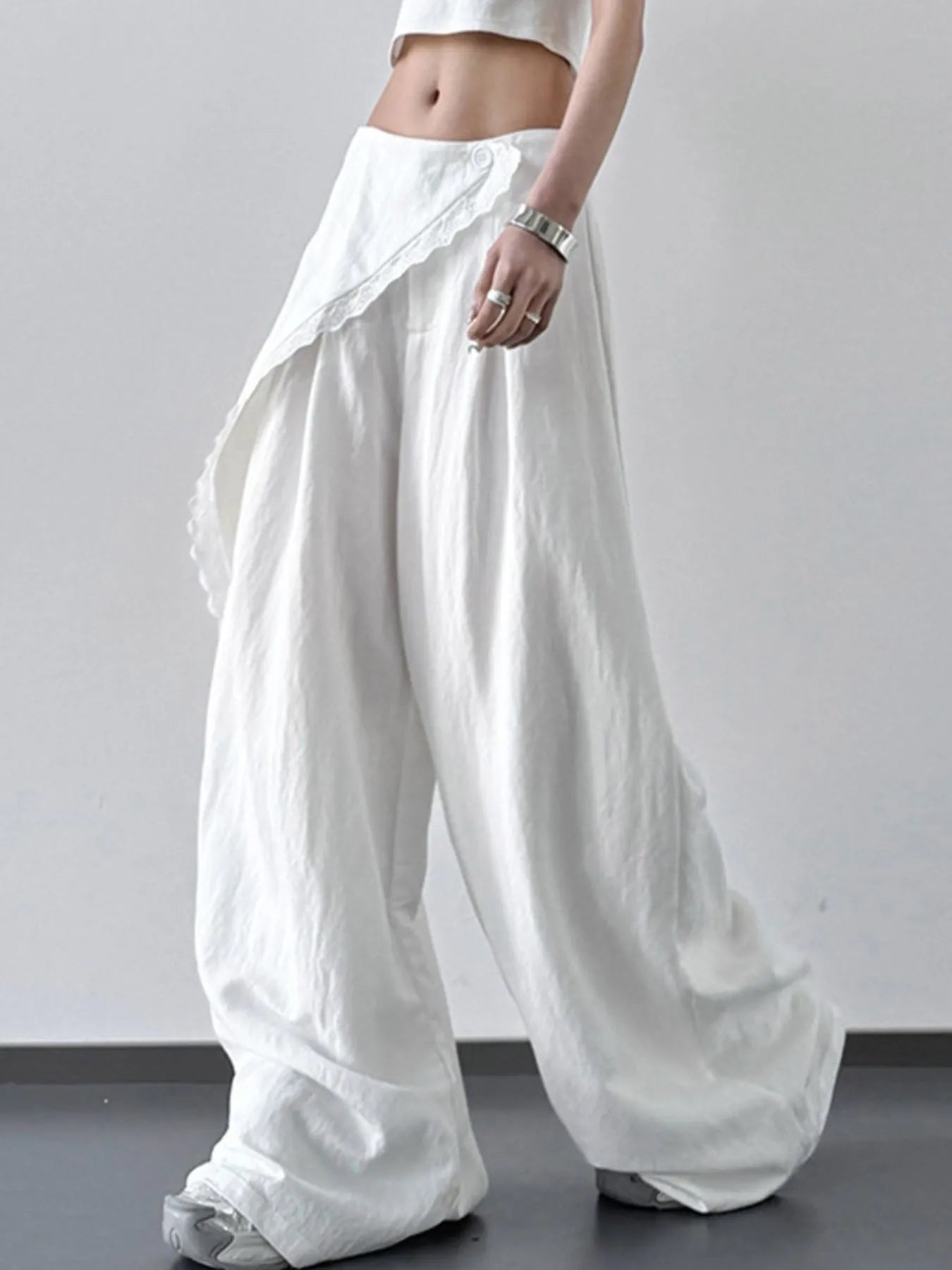 Light blue lace detail wide leg pants by Trendsi, featuring flowing fabric and elegant lace accents for a stylish look.