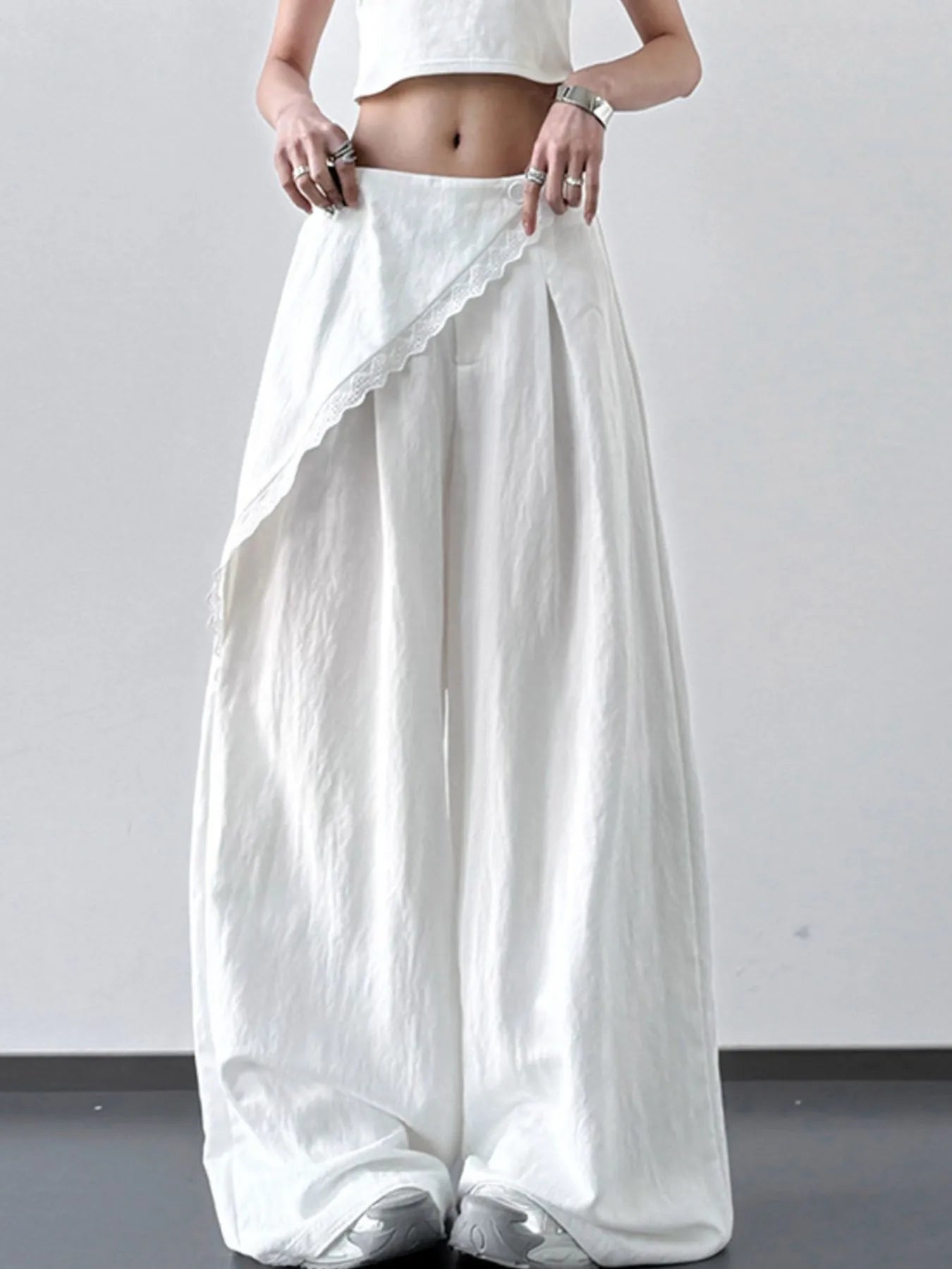 Light blue lace detail wide-leg pants by Trendsi, featuring flowing fabric and elegant design.
