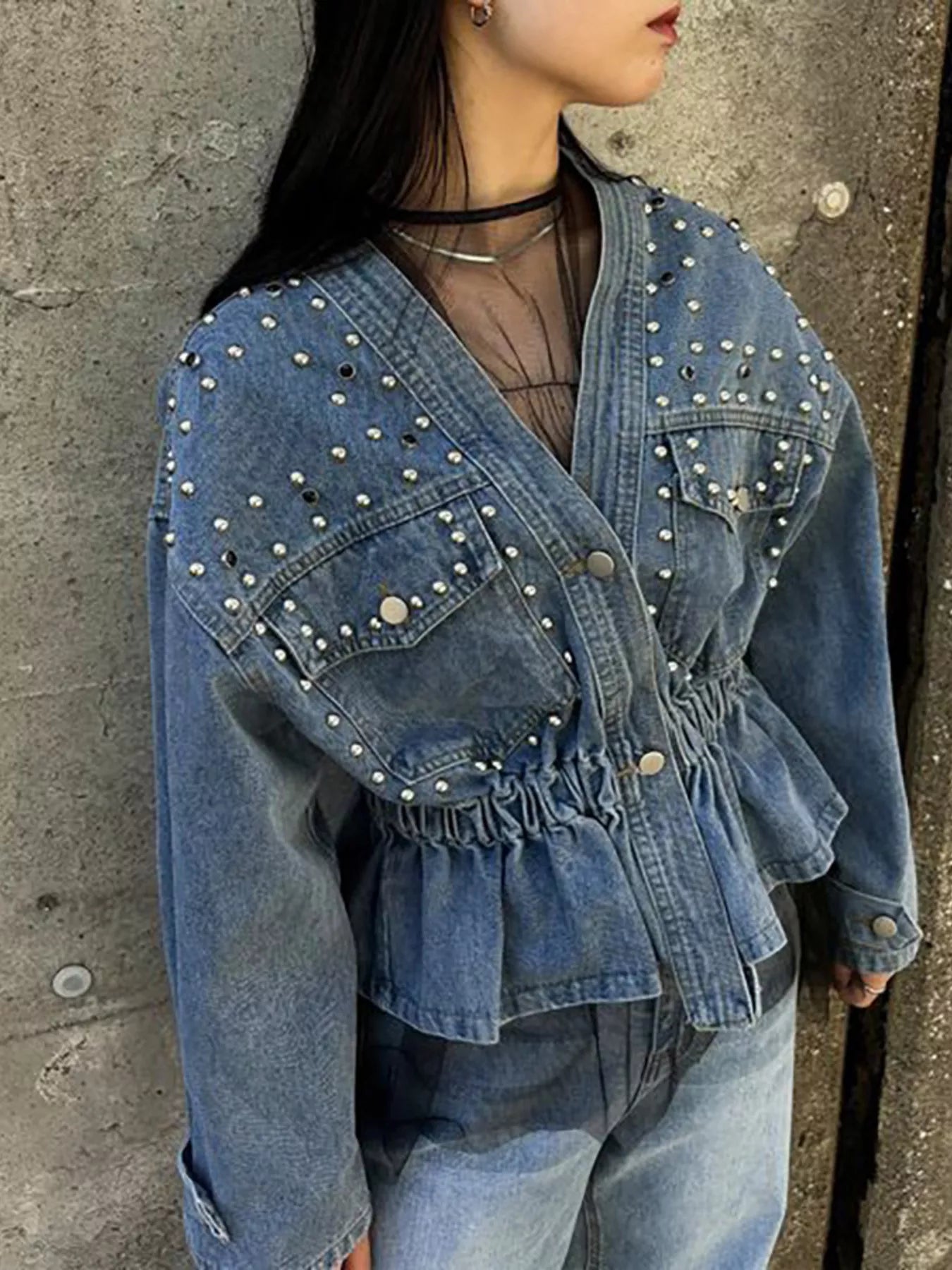 Light blue studded button-up denim jacket by Trendsi, featuring metal stud accents and classic collar design.