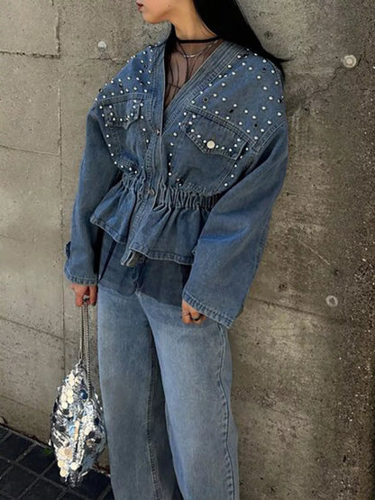 Light blue studded button-up denim jacket by Trendsi, featuring metal studs and classic collar detail.