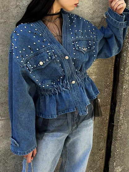 Light blue studded button-up denim jacket by Trendsi, featuring metal studs and classic denim style with collar and front pockets.