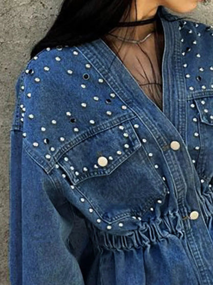 Light blue studded button-up denim jacket by Trendsi, featuring metal studs and classic denim design.