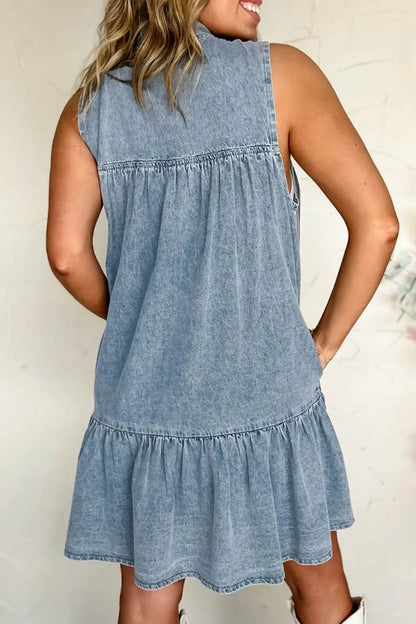 Light blue sleeveless denim dress with tie neck from Trendsi, featuring a casual fit and classic denim texture.