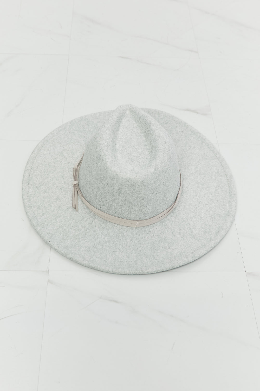 Light gray Fame Festival Babe Fedora Hat by Trendsi, featuring a wide brim and stylish design for a trendy festival look.