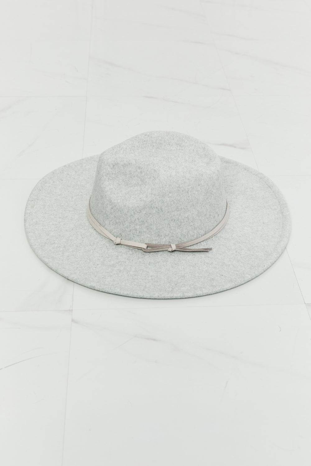 Light gray Fame Festival Babe Fedora Hat by Trendsi, showcasing a stylish wide-brim fedora with a classic design.