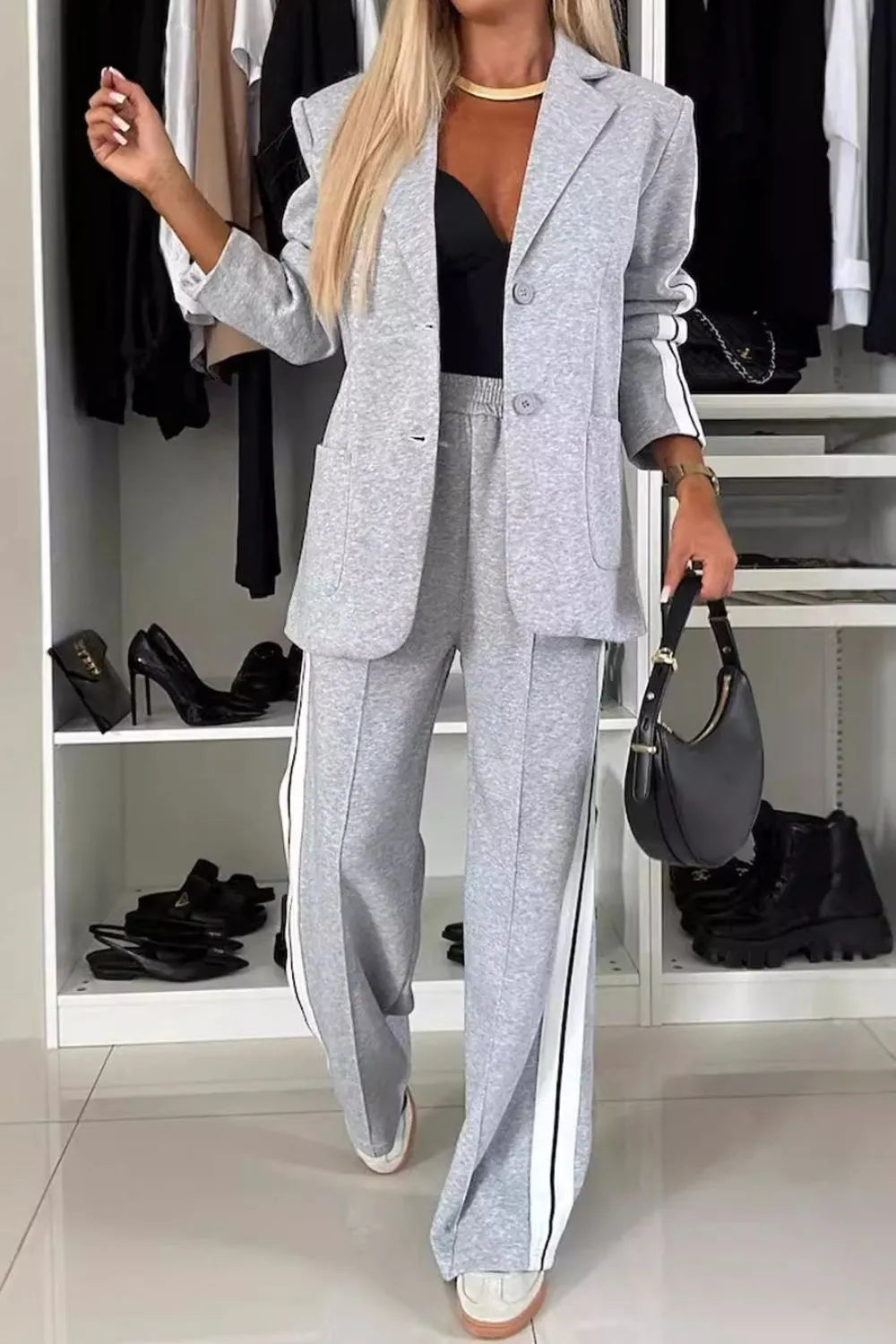 Full size contrast lapel collar top and pants set by Trendsi, featuring a stylish coordinated outfit with a lapel collar design.