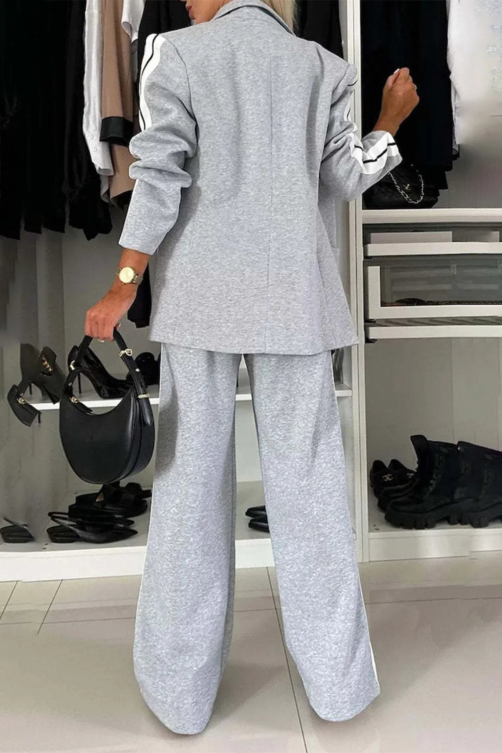 Full size contrast lapel collar top and pants set by Trendsi, featuring a stylish matching outfit with lapel collar detail.