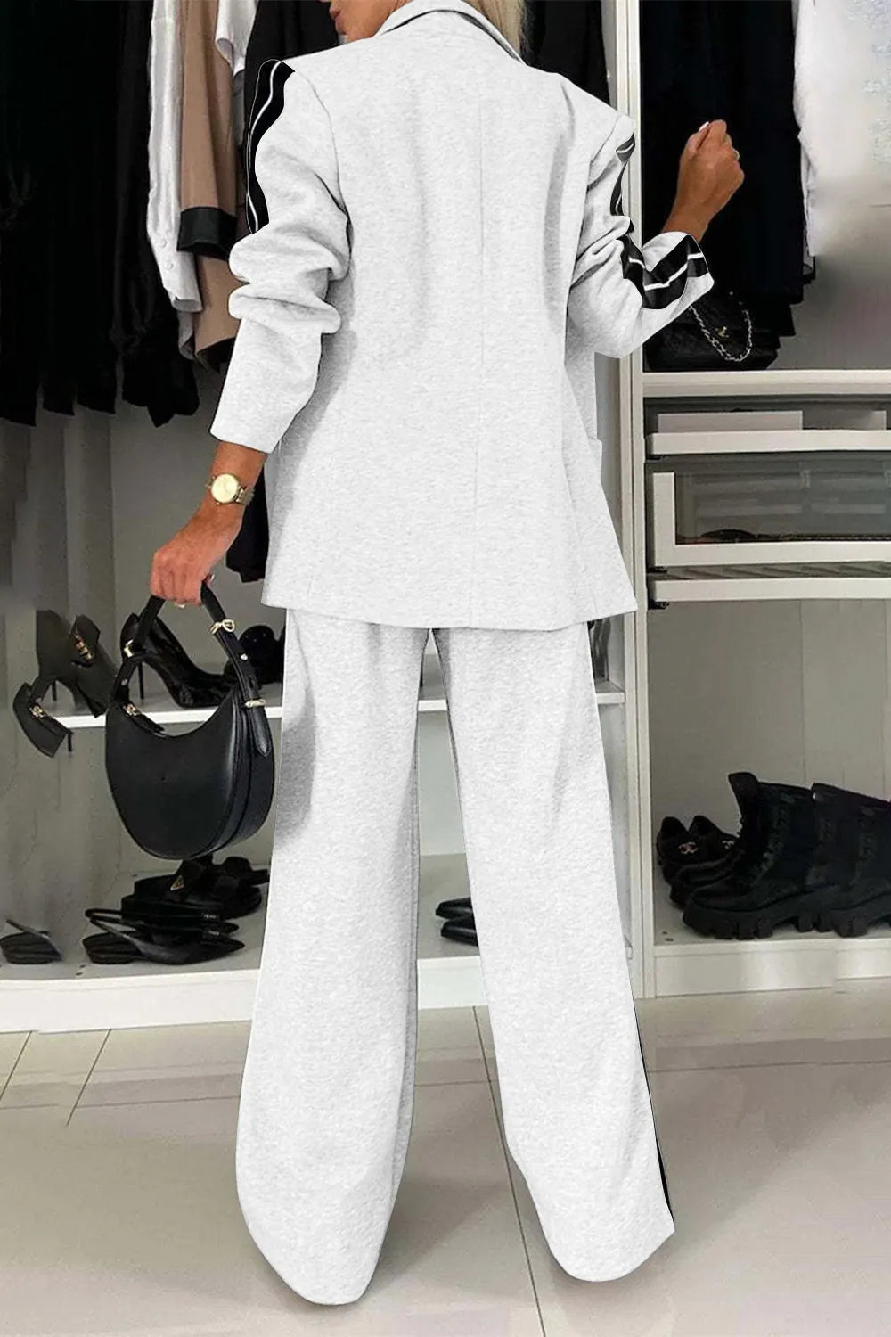 Full size contrast lapel collar top and pants set by Trendsi, featuring a stylish matching outfit with a lapel collar and tailored fit.