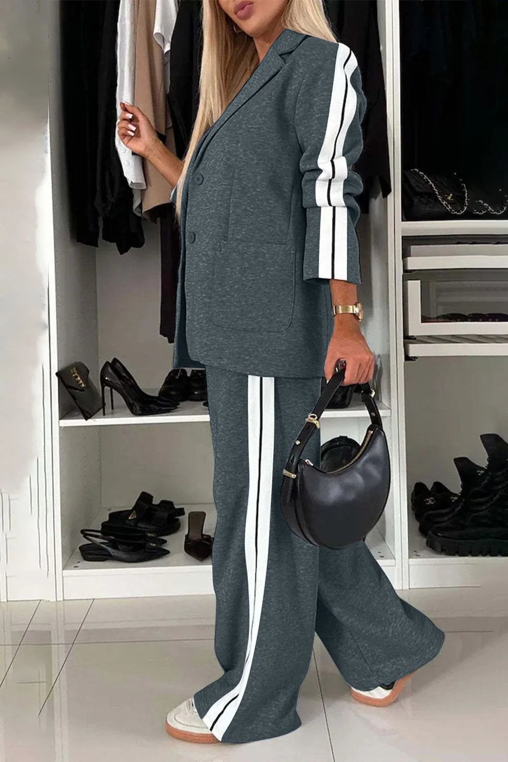 Full size contrast lapel collar top and pants set by Trendsi, featuring a stylish tailored look with a matching coordinated design.