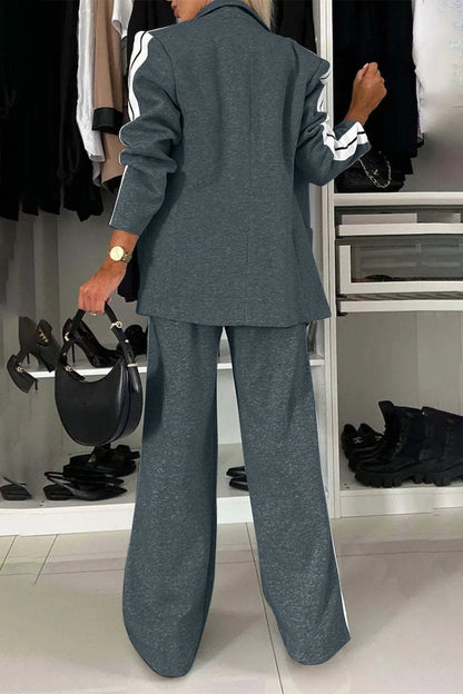 Full size contrast lapel collar top and pants set from Trendsi, featuring a stylish matching outfit with a lapel collar design.