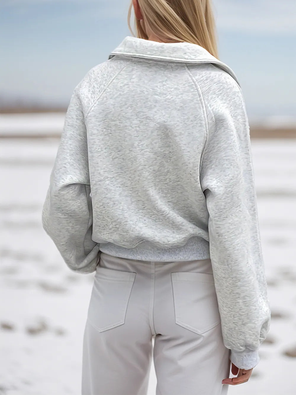 Light gray Trendsi half zip long sleeve sweatshirt with a fitted design, suitable for casual wear and layering.