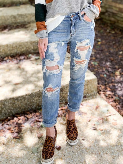 Light blue distressed skinny jeans by Trendsi featuring rips and a fitted silhouette, styled for casual wear.