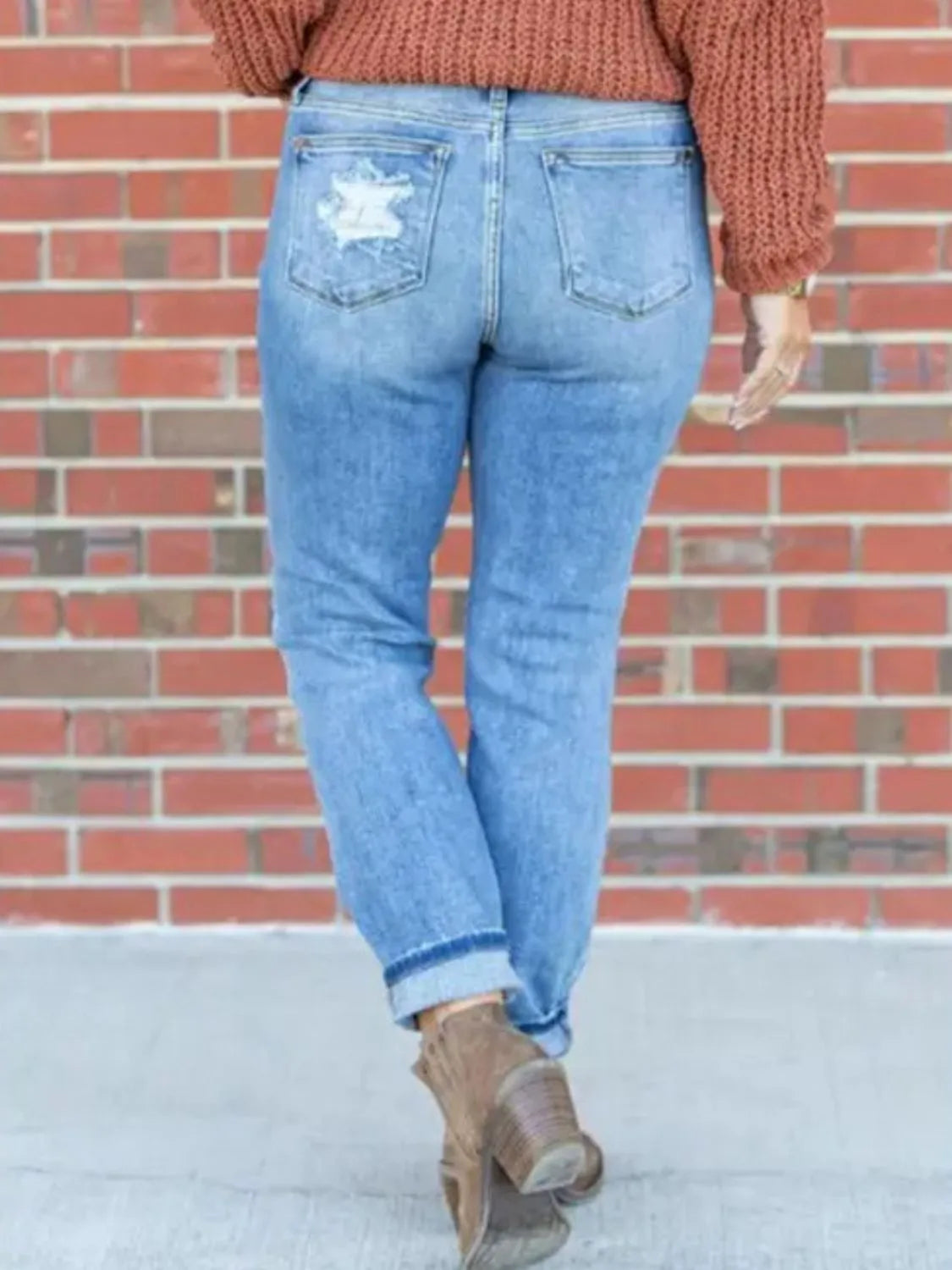 Light-wash distressed skinny jeans from Trendsi, featuring a faded look, ripped details, and a fitted silhouette.