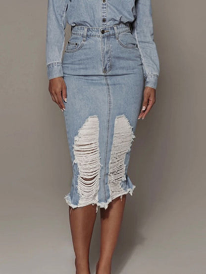 Light wash distressed slit denim skirt from Trendsi, showing front view with frayed hem and distressed details.
