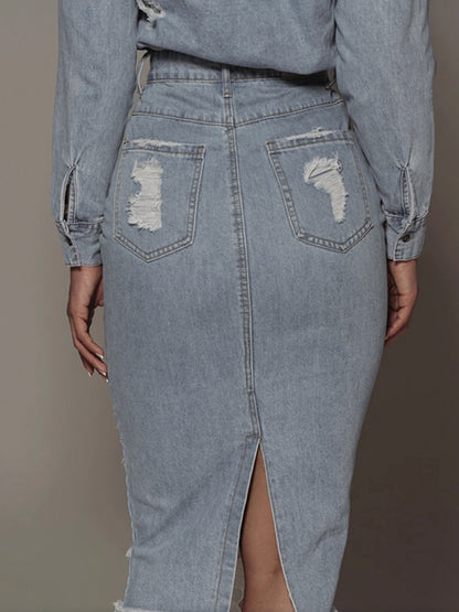 Light wash distressed slit denim skirt from Trendsi, featuring frayed edges and a high slit for a casual, trendy look.
