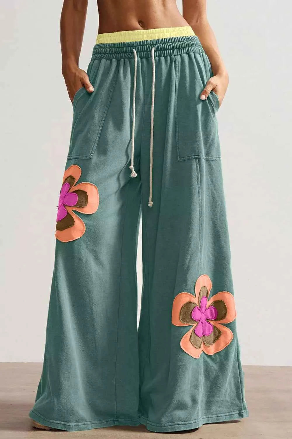 Turquoise floral patchwork wide-leg lounge pants by Trendsi, featuring a relaxed fit and stylish design.