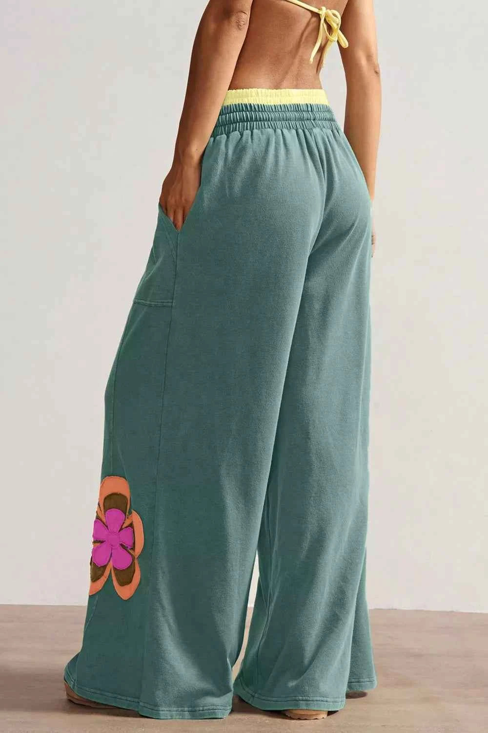 Turquoise floral patchwork wide leg lounge pants by Trendsi, featuring comfortable fit and stylish floral design.
