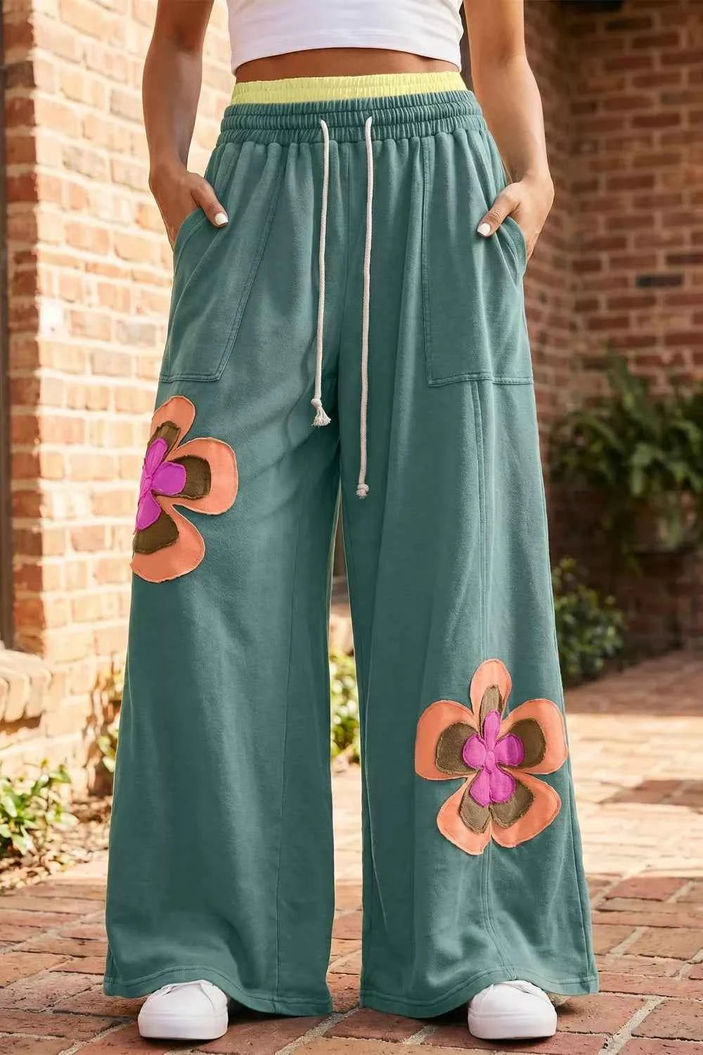 Turquoise floral patchwork wide-leg lounge pants by Trendsi, featuring a relaxed fit and vibrant floral design.