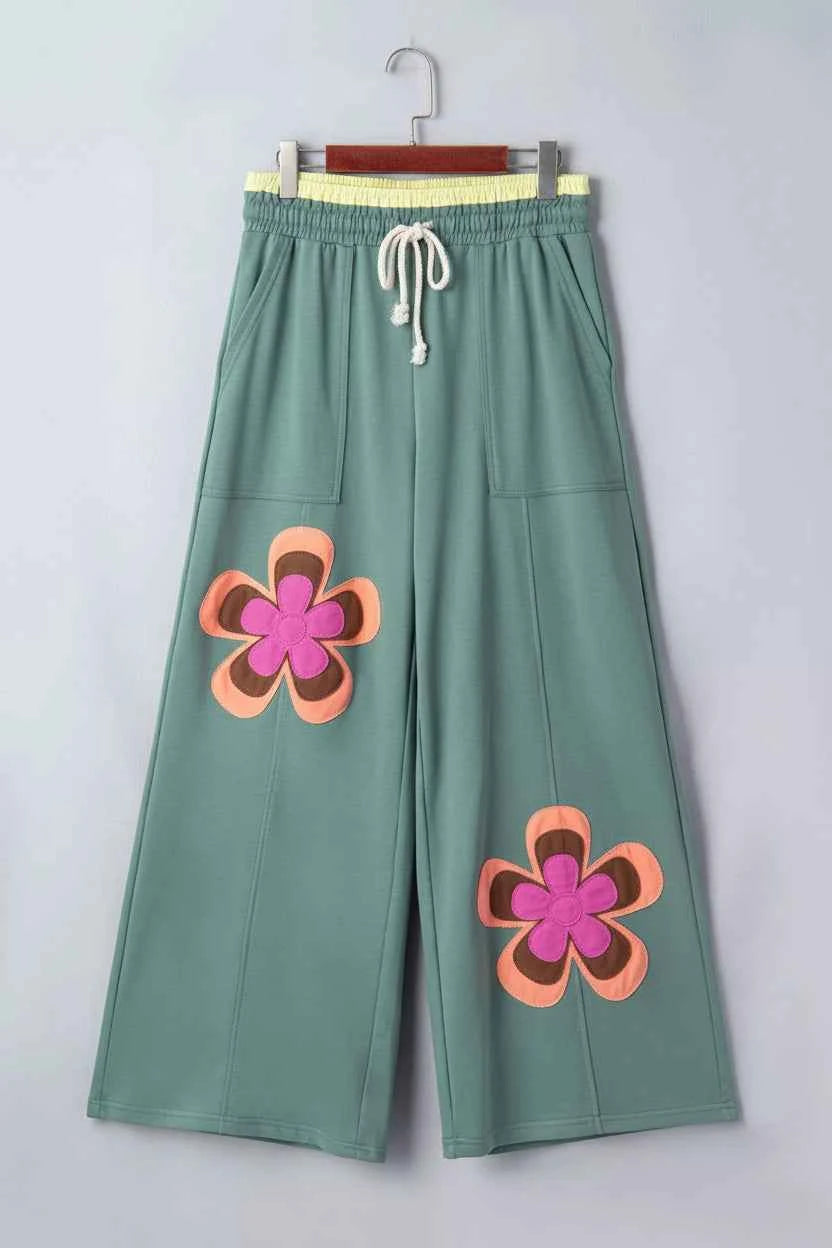 Turquoise floral patchwork lounge pants by Trendsi with wide-leg design, comfortable fit, perfect for casual or relaxed wear.