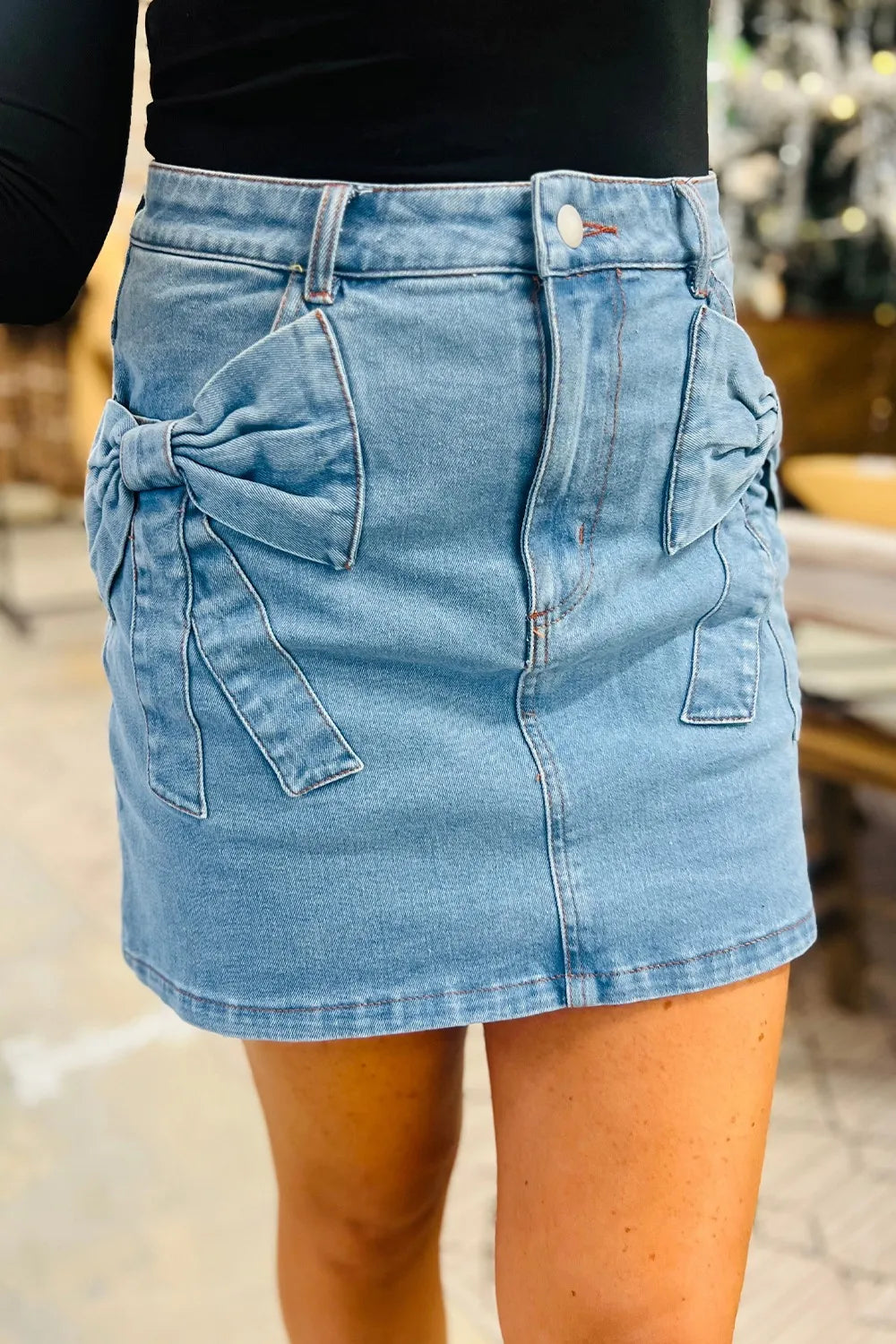 High waist denim skirt with acid wash finish and bowknot details, stylish and trendy from Trendsi.