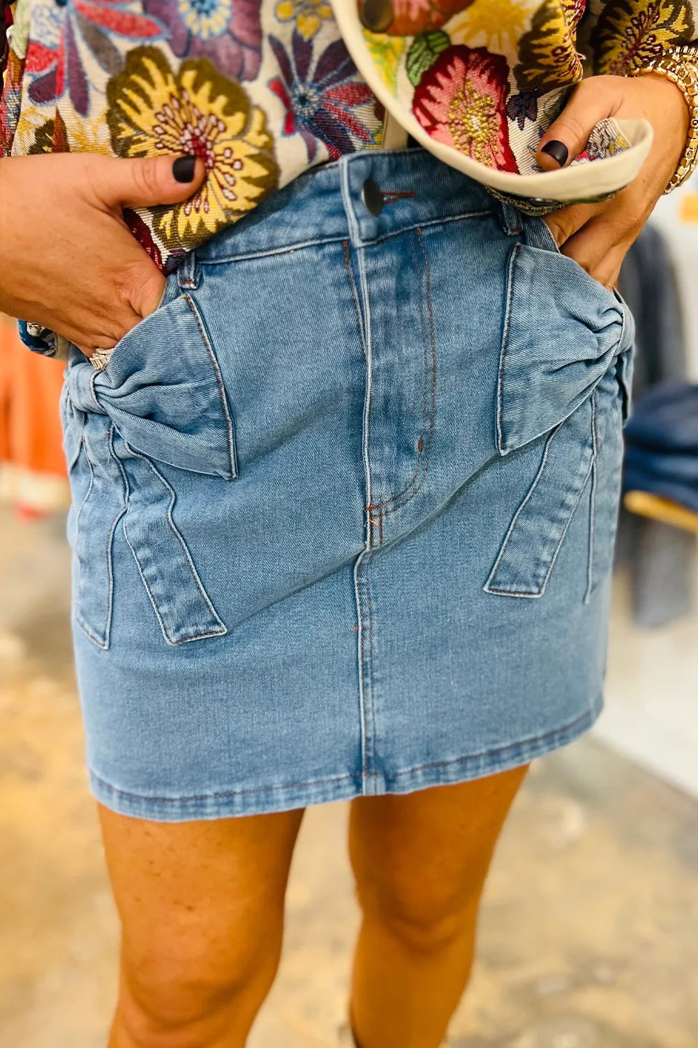 Medium-length acid wash high waist denim skirt with bowknot details from Trendsi, styled with a casual, trendy look.