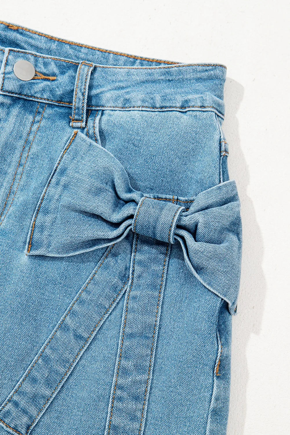 Trendsi acid wash high waist denim skirt with bowknot details, stylish and casual for everyday wear.