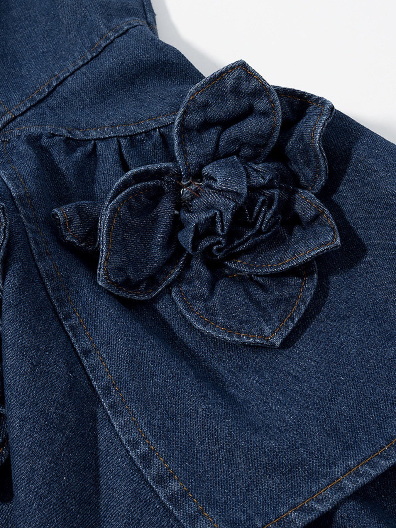 Medium-length floral ruffle layered denim dress by Trendsi, featuring a feminine design with ruffles and a casual denim style.