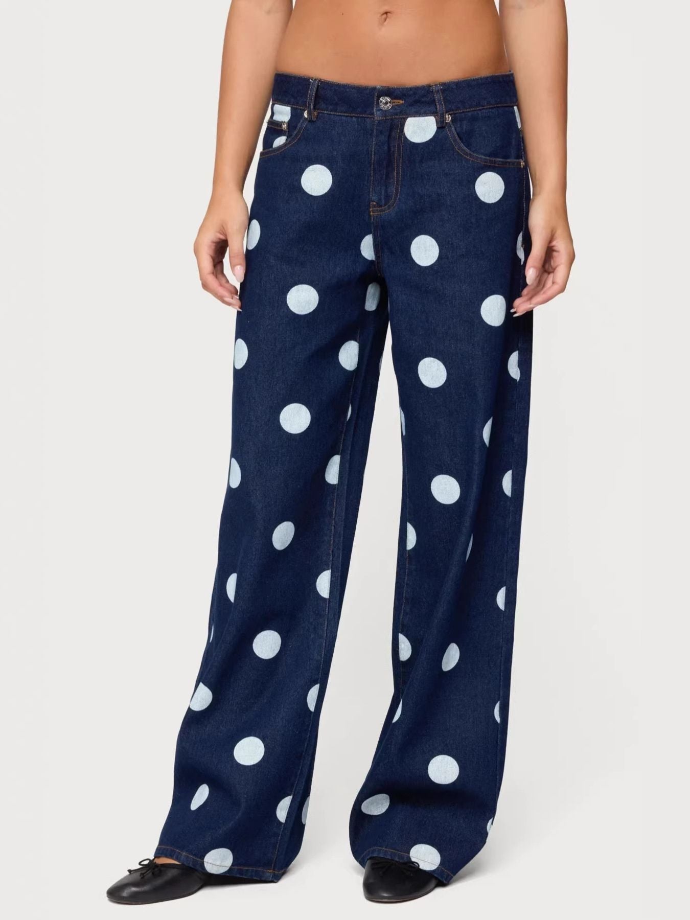 Trendsi polka dot wide leg jeans featuring a relaxed fit, high waist, and bold black and white polka dot pattern.