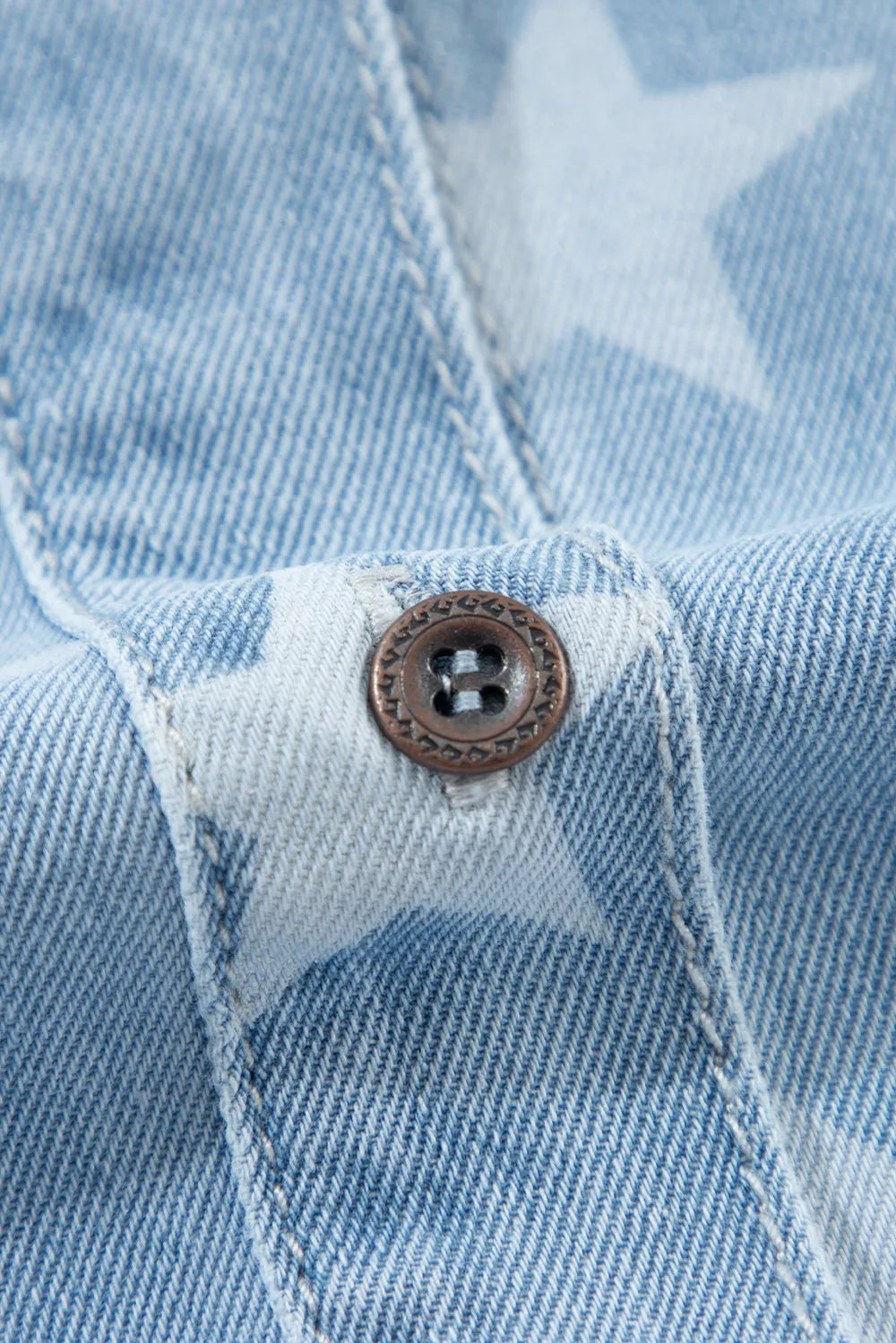 Raw hem star embroidered denim top with a collared neck from Trendsi, featuring a casual, stylish design and medium wash fabric.