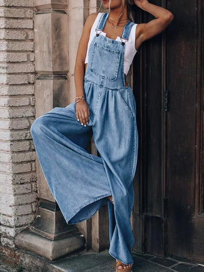 Trendsi wide leg denim overalls featuring adjustable straps, front pockets, and a relaxed fit on a light wash denim fabric.