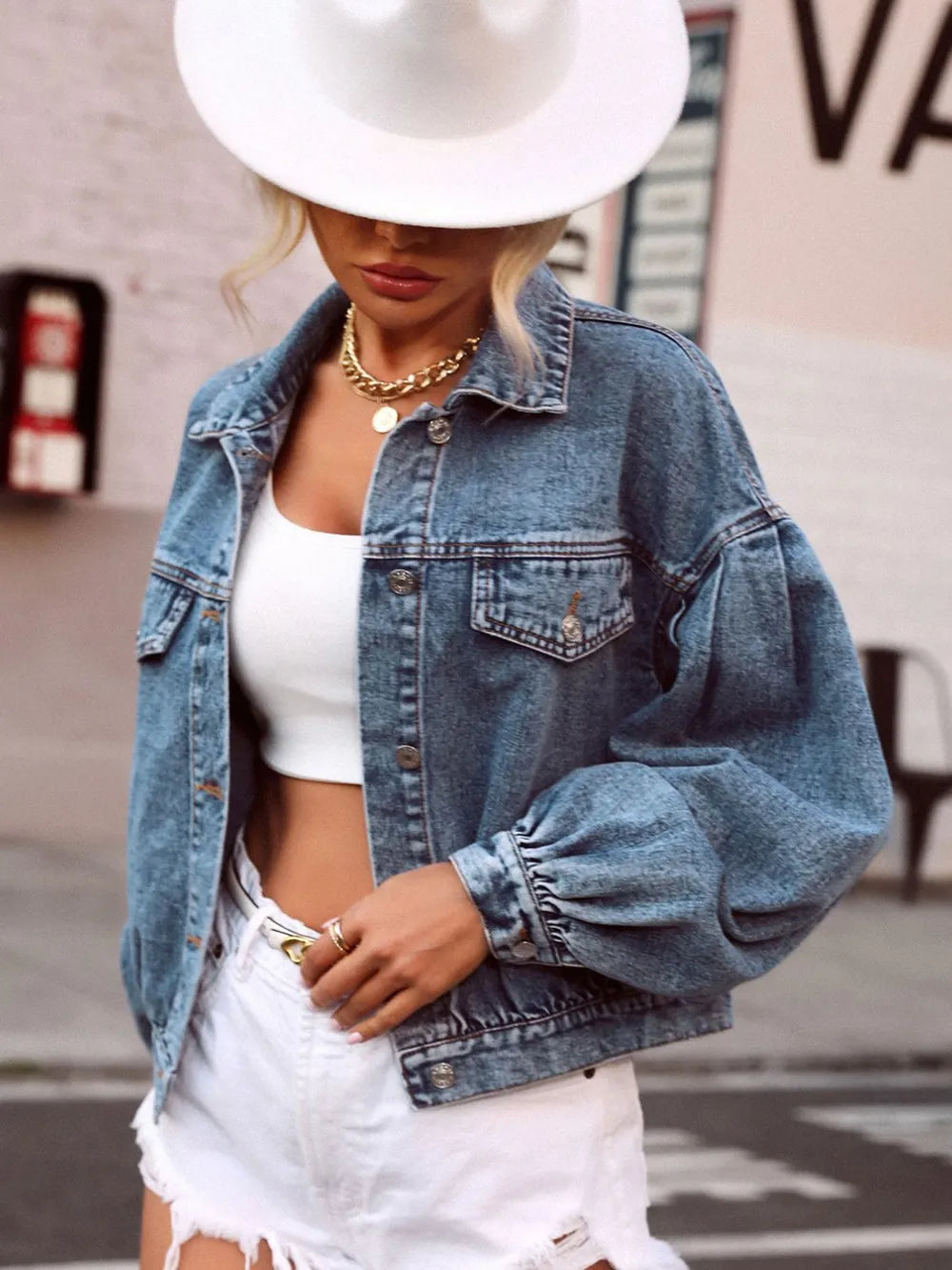 Medium-sized denim top with a collared neck and dropped shoulders, featuring a casual, stylish design by Trendsi.