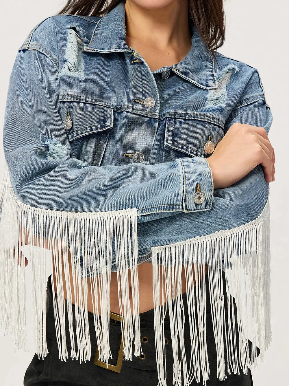 Distressed fringe-collared cropped denim top by Trendsi, featuring a classic collar and frayed edges for a trendy, casual look.