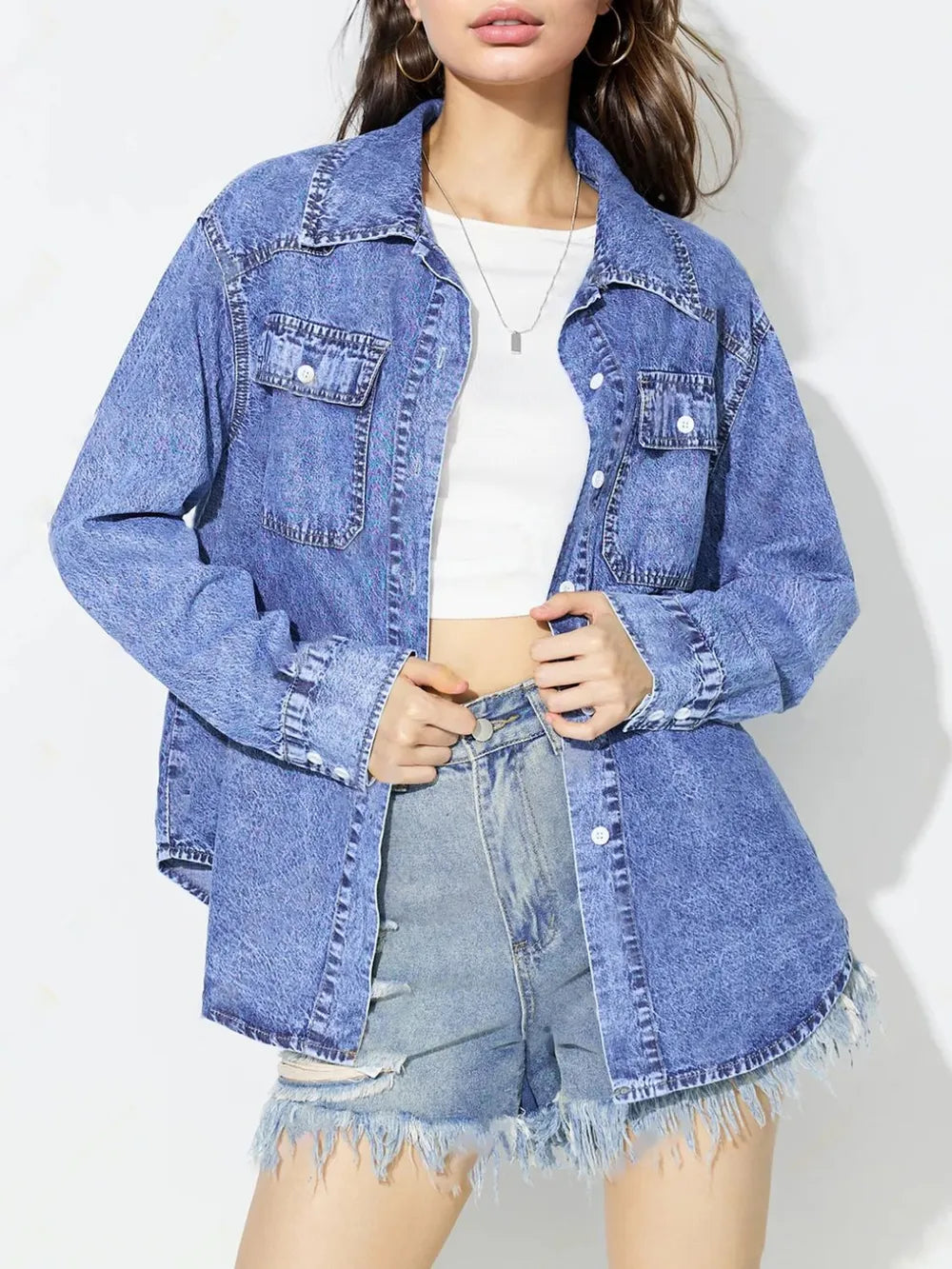 Medium blue denim top with curved hem, styled by Trendsi, featuring a casual fit perfect for everyday wear.