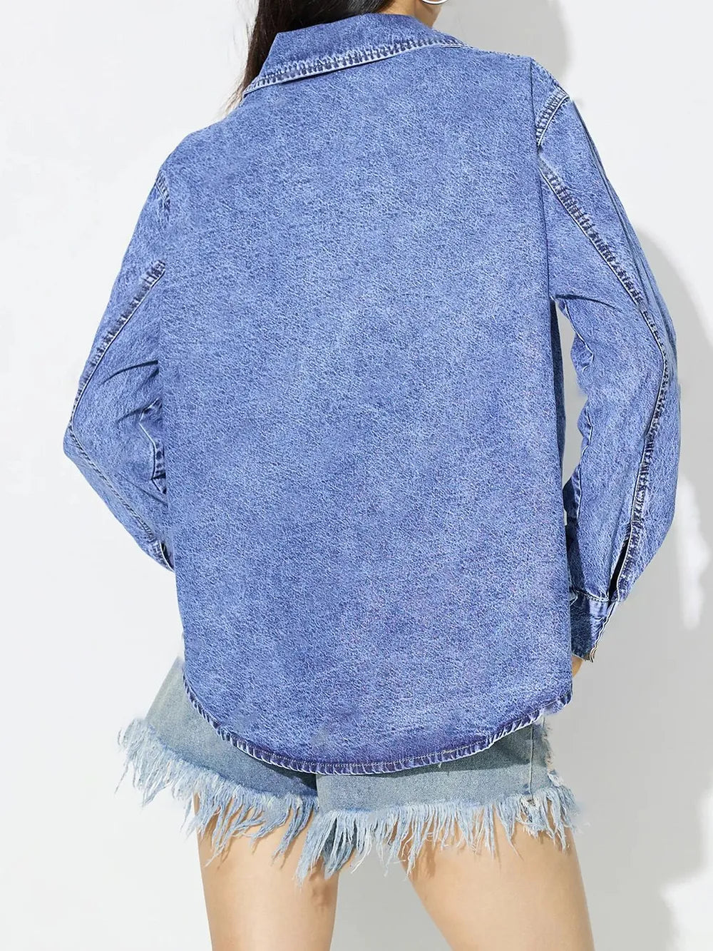 Medium blue denim top with curved hem from Trendsi, featuring a casual fit and stylish design for versatile everyday wear.
