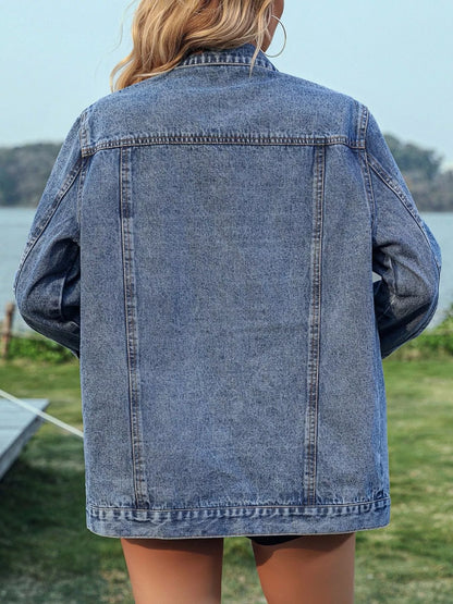 Studded button-up denim jacket by Trendsi featuring silver studs on classic blue denim with front pockets and button closure.