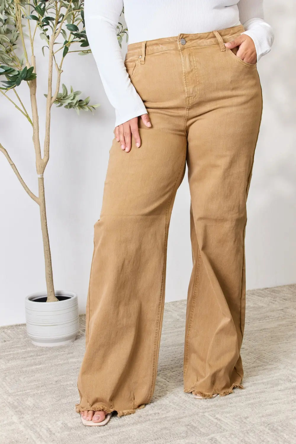 Risen full size fringe hem wide-leg jeans from Trendsi, featuring a relaxed fit with stylish fringe detail on the hem.