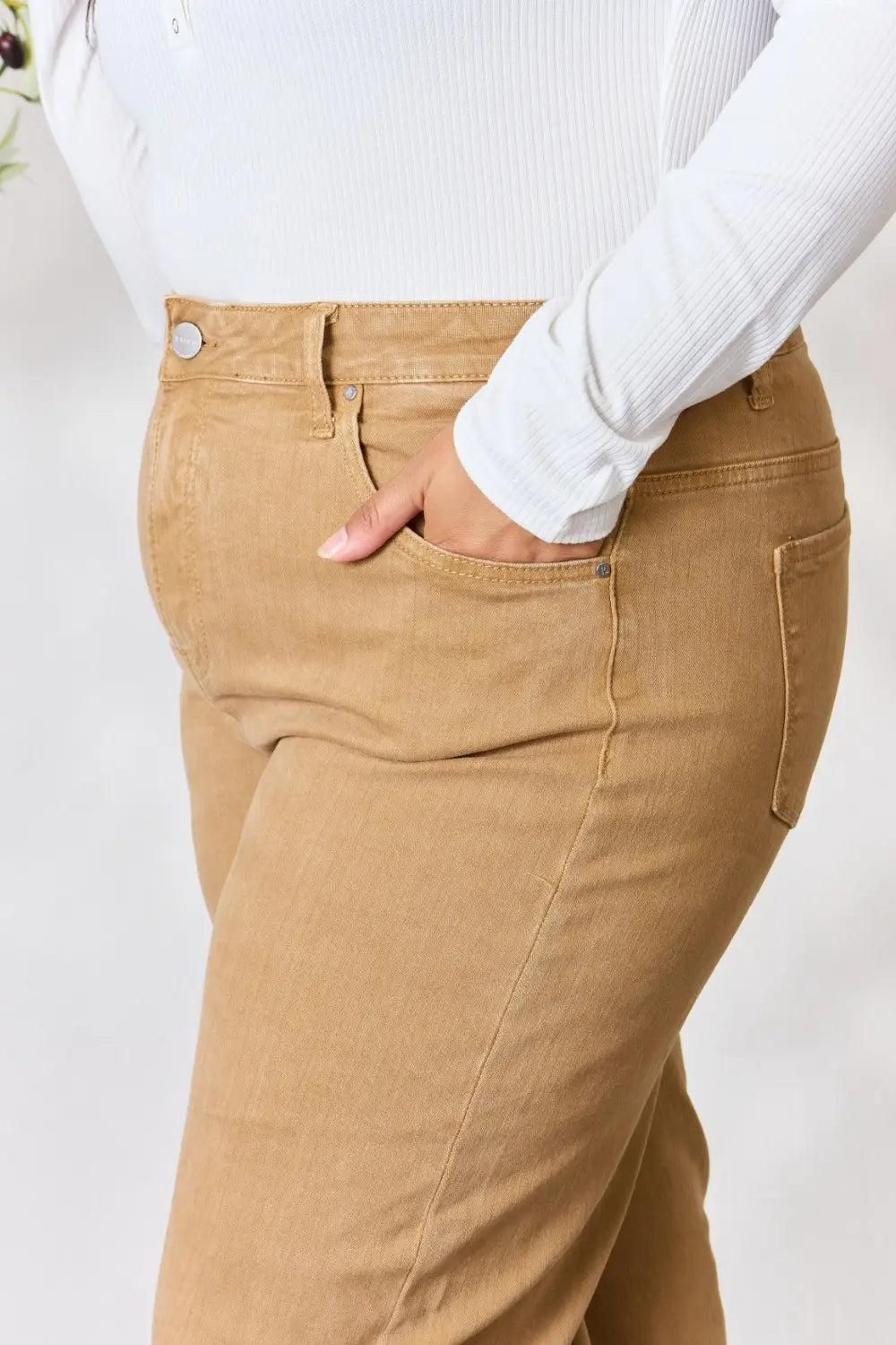Risen full size fringe hem wide leg jeans with distressed details and classic blue denim, styled for a casual, trendy look.